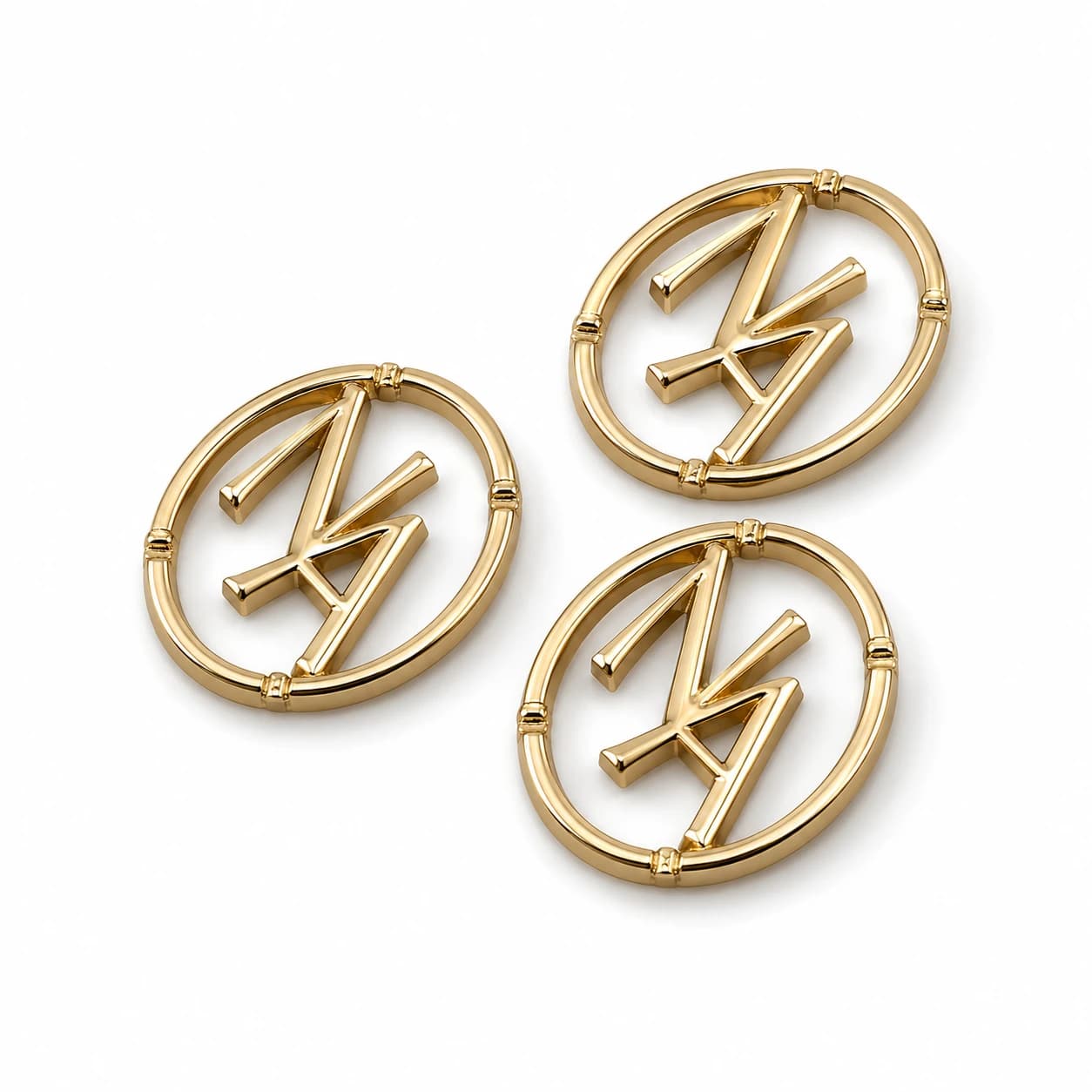 A set of small zinc alloy emblems in existing in-house styles