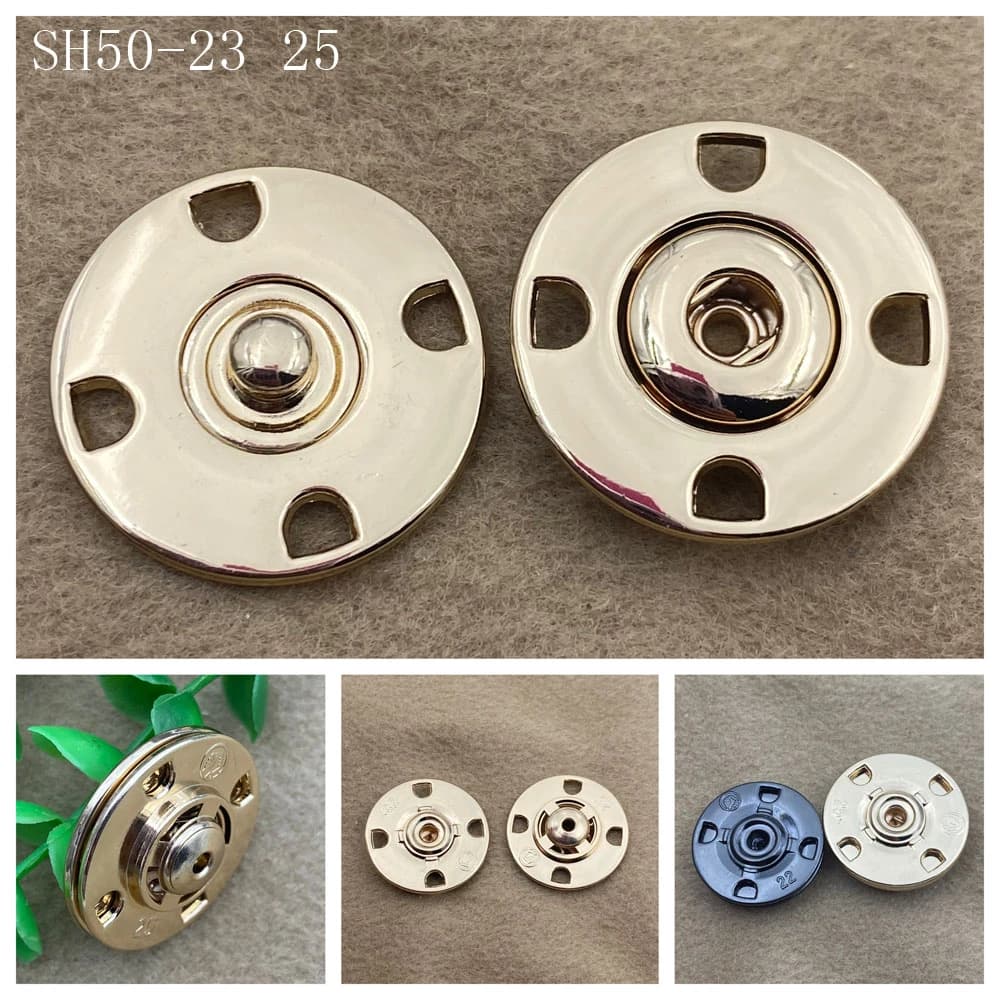 The four-part structure of a metal snap button laid out