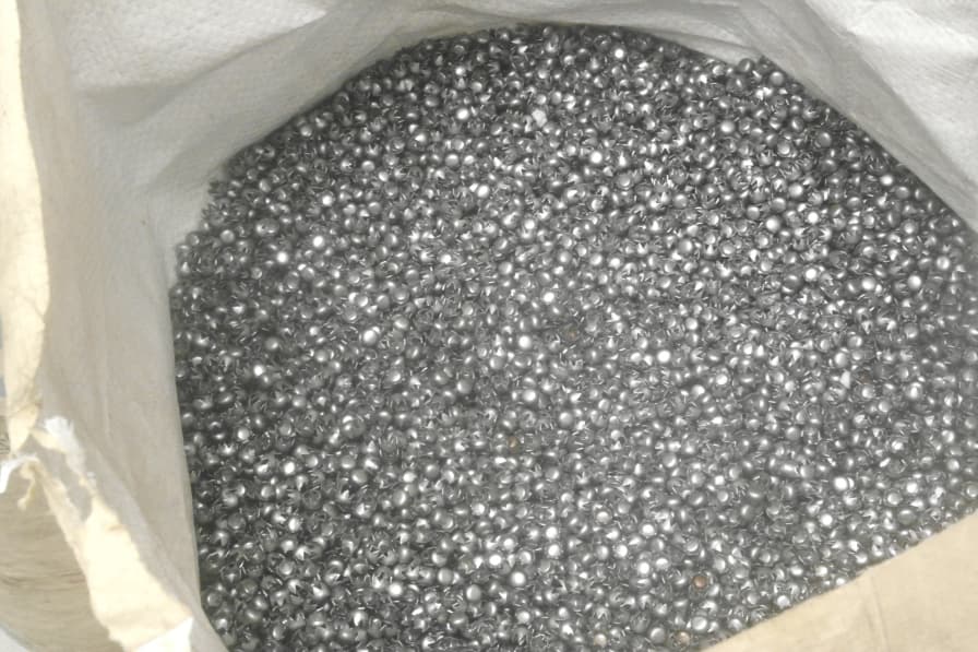 Bag of small zinc alloy casting blanks before finishing