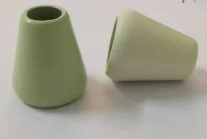 Solid brass cord ends and bell stoppers showing the natural warm brass tone