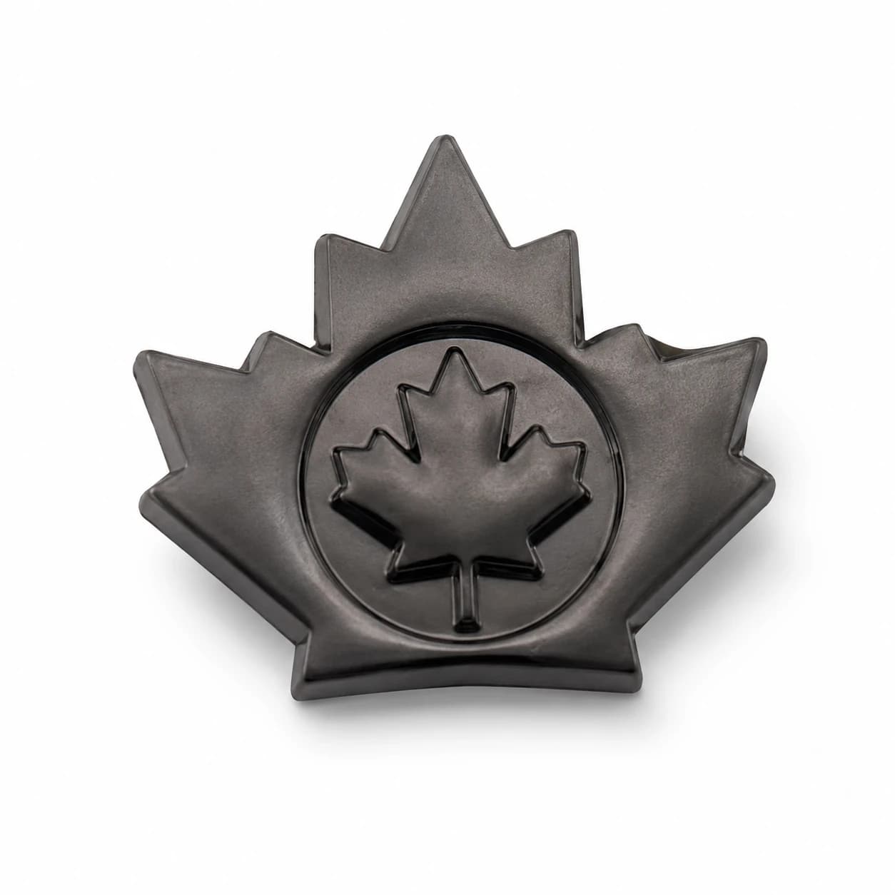 A custom zinc alloy maple leaf metal badge sample